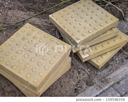 Yellow Tactile Paving Slabs for Accessibility Yellow Tactile Paving Slabs for Accessibility 139596356