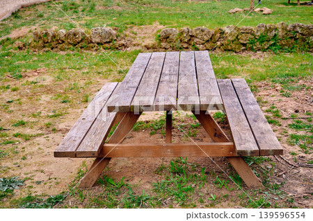 Outdoors picnic area wooden table Outdoors picnic area wooden table 139596554