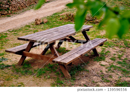 Outdoors picnic area wooden table 139596556