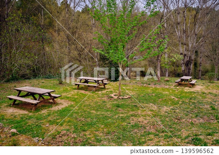 Outdoors picnic area wooden table 139596562