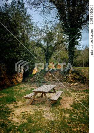 Outdoors picnic area wooden table Outdoors picnic area wooden table 139596563