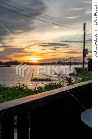 Sunset sky with the silhouette of riverside building Sunset sky with the silhouette of riverside building 139596618