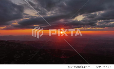 Sunset over mountain with dramatic clouds Sunset over mountain with dramatic clouds 139596672