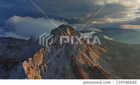 Amazing rocky mountains in clouds at sunset 139596688