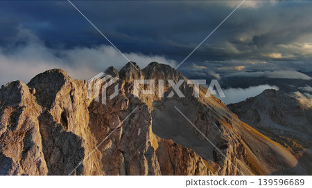 Amazing rocky mountains in clouds at sunset 139596689