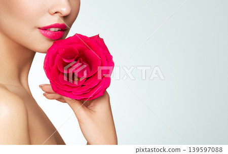 Beautiful young woman a rose flower Beautiful young woman a rose flower 139597088