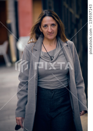 portrait of a young woman on a city street portrait of a young woman on a city street 139597143