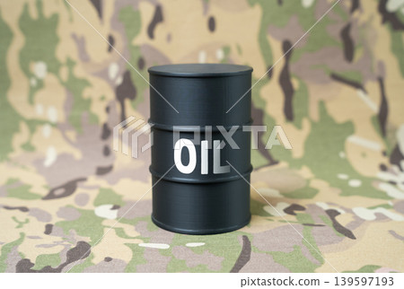 A barrel of oil against a military backdrop. Concept of fuel and control of oil trade flows. Energy security, sanctions pressure and strategic resource management during conflict. A barrel of oil against a military backdrop. Concept of fuel and control of oil trade flows. Energy security, sanctions pressure and strategic resource management during conflict. 139597193