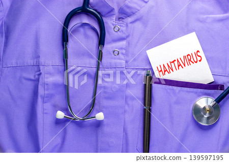 Hantavirus medical words symbol. Concept words Hantavirus on beautiful white card on medical uniform. Beautiful blue background. Beautiful pen. Stethoscope. Medical Hantavirus concept. Copy space. Hantavirus medical words symbol. Concept words Hantavirus on beautiful white card on medical uniform. Beautiful blue background. Beautiful pen. Stethoscope. Medical Hantavirus concept. Copy space. 139597195