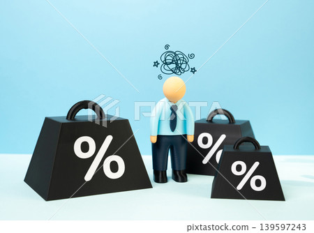An office worker is saddled with debt. A businessman is under severe tax pressure. Financial stress, rising obligations and risks of insolvency for employees and companies. 139597243