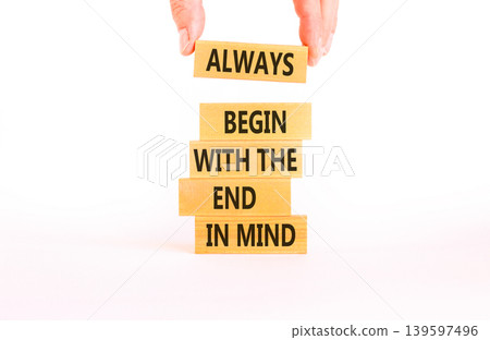 Begin with the end in mind symbol. Concept words Always begin with the end in mind on beautiful wooden blocks. Beautiful white background. Business begin with the end in mind concept. Copy space. 139597496