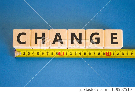 Change symbol. Concept word Change on beautiful wooden blocks. Beautiful blue background. Beautiful yellow tape measure ruler. Business change concept. Copy space. 139597519
