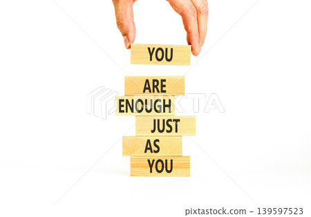 You are enough symbol. Concept words You are enough just as you on beautiful wooden sticks. Beautiful white background. Business motivational and you are enough just as you concept. Copy space. You are enough symbol. Concept words You are enough just as you on beautiful wooden sticks. Beautiful white background. Business motivational and you are enough just as you concept. Copy space. 139597523