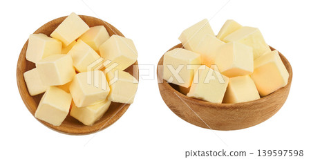 butter cubes in wooden bowl isolated on white background with full depth of field. Top view. Flat lay. butter cubes in wooden bowl isolated on white background with full depth of field. Top view. Flat lay. 139597598