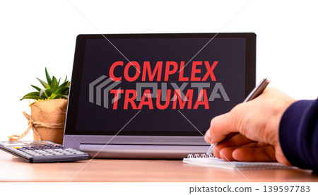 Complex trauma words symbol. Concept words Complex trauma on beautiful black tablet. Beautiful white background. Psychologist hand. Psychological complex trauma support concept. Copy space. Complex trauma words symbol. Concept words Complex trauma on beautiful black tablet. Beautiful white background. Psychologist hand. Psychological complex trauma support concept. Copy space. 139597783