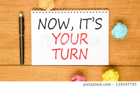 Now it's your turn symbol. Concept words Now it's your turn on beautiful white note. Beautiful wooden background. Colored paper. Business Now it's your turn motivational support concept. Copy space 139597785
