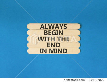 Begin with the end in mind symbol. Concept words Always begin with the end in mind on beautiful wooden sticks. Beautiful blue background. Business begin with the end in mind concept. Copy space. 139597822