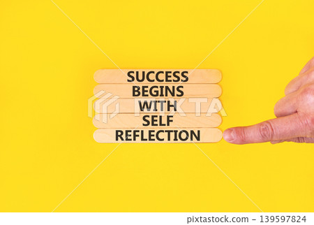 Self reflection symbol. Concept words Success begins with self reflection on beautiful wooden sticks. Beautiful yellow background. Business success begins with self reflection concept. Copy space. Self reflection symbol. Concept words Success begins with self reflection on beautiful wooden sticks. Beautiful yellow background. Business success begins with self reflection concept. Copy space. 139597824