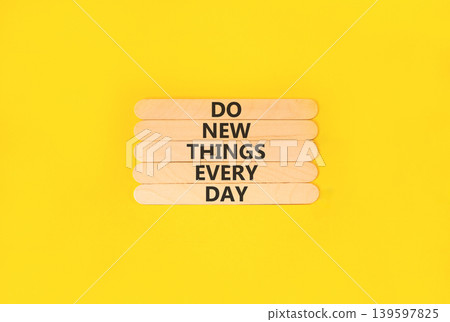 Do new things every day words symbol. Concept words Do new things every day on beautiful wooden sticks. Beautiful yellow paper background. Business do new things every day concept. Copy space. Do new things every day words symbol. Concept words Do new things every day on beautiful wooden sticks. Beautiful yellow paper background. Business do new things every day concept. Copy space. 139597825