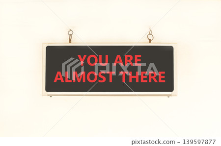 You are almost there words symbol. Concept words You are almost there on beautiful black sign. Beautiful white wall background. Business You are almost there motivational support concept. Copy space. 139597877