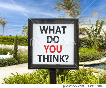 What do you think words symbol. Concept words What do you think on beautiful white sign. Beautiful hotel garden blue sky background. Business What do you think motivational support concept. Copy space What do you think words symbol. Concept words What do you think on beautiful white sign. Beautiful hotel garden blue sky background. Business What do you think motivational support concept. Copy space 139597880