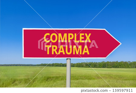 Complex trauma words symbol. Concept words Complex trauma on beautiful red road sign. Beautiful blue sky green field background. Psychological complex trauma support concept. Copy space. 139597911