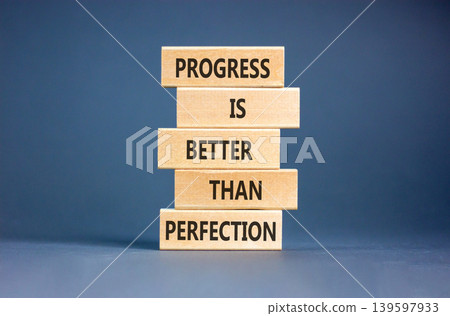 Progress or perfection words symbol. Concept words Progress is better than perfection on beautiful wooden blocks. Beautiful grey paper background. Business progress or perfection concept. Copy space Progress or perfection words symbol. Concept words Progress is better than perfection on beautiful wooden blocks. Beautiful grey paper background. Business progress or perfection concept. Copy space 139597933