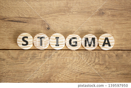 Stigma word symbol. Concept word Stigma on beautiful wooden circles. Beautiful wooden background. Business psychological stigma word concept. Copy space. Stigma word symbol. Concept word Stigma on beautiful wooden circles. Beautiful wooden background. Business psychological stigma word concept. Copy space. 139597950