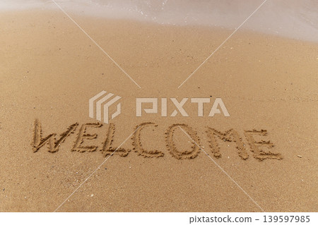 Business hello and welcome concept. Concept word Welcome written on beautiful ocean sea sand beach. Beautiful ocean sand beach background, copy space. Business hello and welcome concept. Business hello and welcome concept. Concept word Welcome written on beautiful ocean sea sand beach. Beautiful ocean sand beach background, copy space. Business hello and welcome concept. 139597985