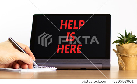 Help is here and support words symbol. Concept words Help is here on beautiful black tablet. Beautiful white background. Businessman hand. Business help is here and support concept. Copy space. Help is here and support words symbol. Concept words Help is here on beautiful black tablet. Beautiful white background. Businessman hand. Business help is here and support concept. Copy space. 139598001
