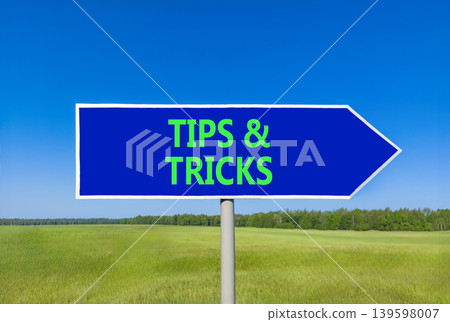 Tips and tricks words symbol. Concept words Tips and tricks on beautiful blue road sign. Beautiful blue sky green field background. Business tips and tricks motivational support concept. Copy space. Tips and tricks words symbol. Concept words Tips and tricks on beautiful blue road sign. Beautiful blue sky green field background. Business tips and tricks motivational support concept. Copy space. 139598007