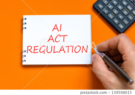 AI act regulation words symbol. Concept words AI artificial intelligence act regulation on beautiful white note. Beautiful orange background. Business AI act regulation concept. Copy space. AI act regulation words symbol. Concept words AI artificial intelligence act regulation on beautiful white note. Beautiful orange background. Business AI act regulation concept. Copy space. 139598015