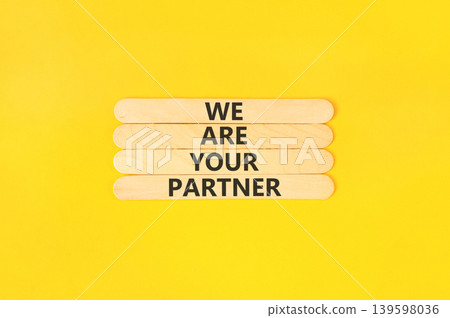 We are your partner words symbol. Concept words We are your partner on beautiful wooden sticks. Beautiful yellow background. Business motivational we are your partner concept. Copy space. We are your partner words symbol. Concept words We are your partner on beautiful wooden sticks. Beautiful yellow background. Business motivational we are your partner concept. Copy space. 139598036