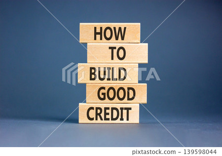 How to build good credit symbol. Concept words How to build good credit on beautiful wooden blocks. Beautiful grey paper background. Business how to build good credit concept. Copy space. How to build good credit symbol. Concept words How to build good credit on beautiful wooden blocks. Beautiful grey paper background. Business how to build good credit concept. Copy space. 139598044
