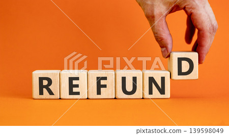Refund word symbol. Concept word Refund on beautiful wooden blocks. Beautiful orange background. Businessman's hand. Business word refund concept. Copy space. 139598049