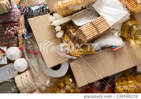 Essential home food stock for military operations and crises and for the period of quarantine and isolation, canned food, pasta, flour and nonperishable items,the concept of stay at home Essential home food stock for military operations and crises and for the period of quarantine and isolation, canned food, pasta, flour and nonperishable items,the concept of stay at home 139598229
