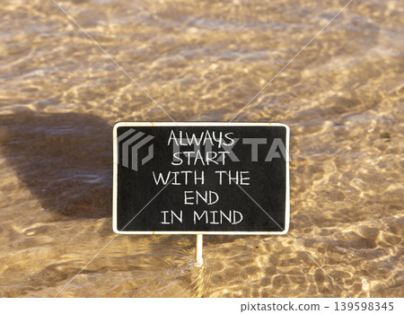 Start with the end in mind symbol. Concept words Always start with the end in mind on beautiful blackboard. Beautiful sea water background. Business start with the end in mind concept. Copy space. Start with the end in mind symbol. Concept words Always start with the end in mind on beautiful blackboard. Beautiful sea water background. Business start with the end in mind concept. Copy space. 139598345