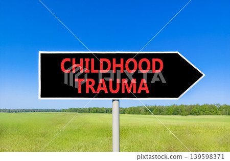 Childhood trauma words symbol. Concept words Childhood trauma on beautiful black road sign. Beautiful blue sky green field background. Psychological childhood trauma support concept. Copy space. Childhood trauma words symbol. Concept words Childhood trauma on beautiful black road sign. Beautiful blue sky green field background. Psychological childhood trauma support concept. Copy space. 139598371