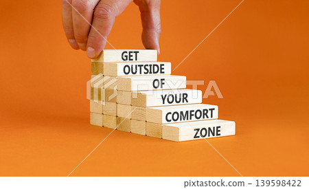Leave your comfort zone symbol. Concept words Get outside of your comfort zone on beautiful wooden stick. Beautiful orange background. Business psychological Leave comfort zone concept. Copy space. Leave your comfort zone symbol. Concept words Get outside of your comfort zone on beautiful wooden stick. Beautiful orange background. Business psychological Leave comfort zone concept. Copy space. 139598422