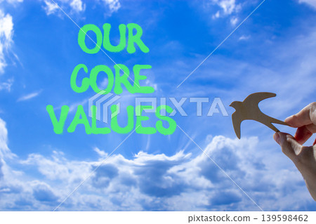 Our core values words symbol. Concept words Our core values on beautiful blue sky. Beautiful blue sky background. Businessman hand. Business our core values motivational support concept. Copy space. Our core values words symbol. Concept words Our core values on beautiful blue sky. Beautiful blue sky background. Businessman hand. Business our core values motivational support concept. Copy space. 139598462