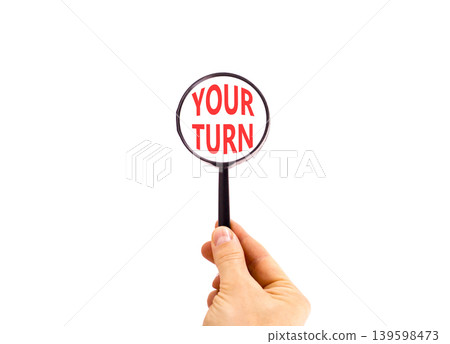 Your turn words symbol. Concept words Your turn on beautiful magnifying glass. Beautiful white background. Businessman hand. Business your turn motivational support concept. Copy space. Your turn words symbol. Concept words Your turn on beautiful magnifying glass. Beautiful white background. Businessman hand. Business your turn motivational support concept. Copy space. 139598473