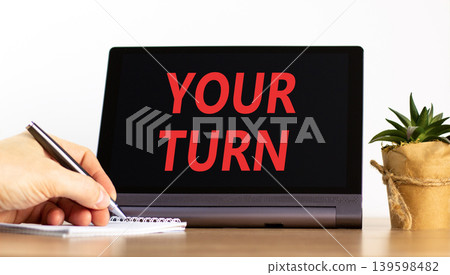 Your turn words symbol. Concept words Your turn on beautiful black tablet. Beautiful white background. Businessman hand. Business your turn motivational support concept. Copy space. Your turn words symbol. Concept words Your turn on beautiful black tablet. Beautiful white background. Businessman hand. Business your turn motivational support concept. Copy space. 139598482