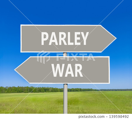 Parley instead war symbol. Concept words Parley and War on beautiful grey road sign. Beautiful blue sky green grass background. Social and parley instead war concept. Copy space. Parley instead war symbol. Concept words Parley and War on beautiful grey road sign. Beautiful blue sky green grass background. Social and parley instead war concept. Copy space. 139598492