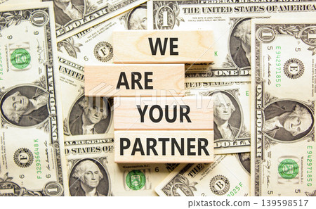 We are your partner words symbol. Concept words We are your partner on beautiful wooden blocks. Beautiful dollar bills background. Business motivational we are your partner concept. Copy space. We are your partner words symbol. Concept words We are your partner on beautiful wooden blocks. Beautiful dollar bills background. Business motivational we are your partner concept. Copy space. 139598517