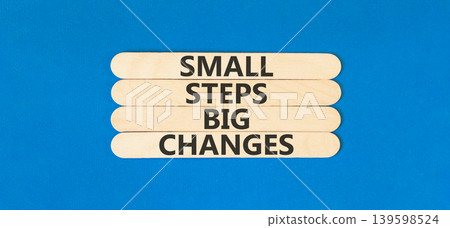Small steps big changes words symbol. Concept words Small steps big changes on beautiful wooden sticks. Beautiful blue background. Business motivational small steps big changes concept. Copy space. Small steps big changes words symbol. Concept words Small steps big changes on beautiful wooden sticks. Beautiful blue background. Business motivational small steps big changes concept. Copy space. 139598524