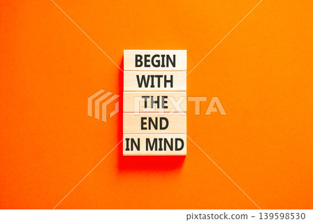 Begin with the end in mind symbol. Concept words Begin with the end in mind on beautiful wooden blocks. Beautiful orange paper background. Business begin with the end in mind concept. Copy space. Begin with the end in mind symbol. Concept words Begin with the end in mind on beautiful wooden blocks. Beautiful orange paper background. Business begin with the end in mind concept. Copy space. 139598530