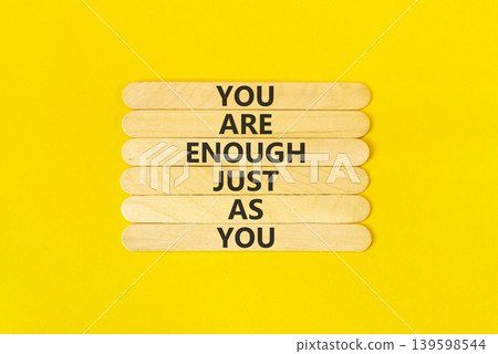 You are enough symbol. Concept words You are enough just as you on beautiful wooden sticks. Beautiful yellow background. Business motivational and you are enough just as you concept. Copy space. You are enough symbol. Concept words You are enough just as you on beautiful wooden sticks. Beautiful yellow background. Business motivational and you are enough just as you concept. Copy space. 139598544