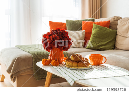 Autumn Table Setting with Pumpkin Shaped Buns with Cinnamon and Cup of Tea Autumn Table Setting with Pumpkin Shaped Buns with Cinnamon and Cup of Tea 139598726