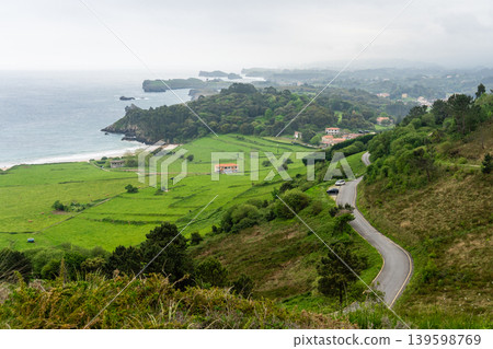 Toranda Beach coastline with green hills and calm waves Toranda Beach coastline with green hills and calm waves 139598769