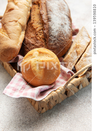 Assortment of fresh baked bread loaves in basket Assortment of fresh baked bread loaves in basket 139598810